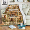 Highland cow throw blanket draped over a sofa in a cozy farmhouse living room