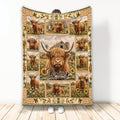 Highland cow blanket displayed upright with rustic farm scenes, sunflowers, daisies, and plaid borders