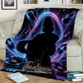 Neon DJ throw blanket displayed on an armchair with turntables, headphones, music notes, and vibrant purple-blue artwork