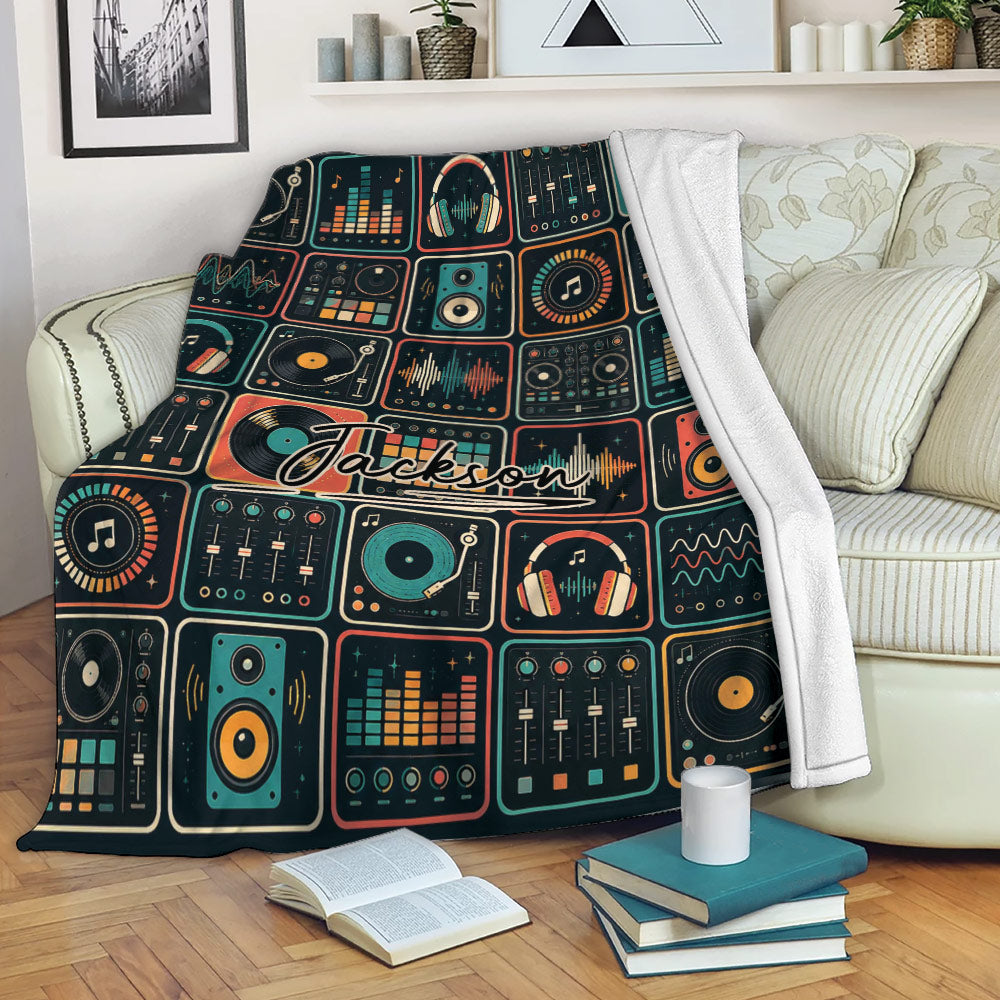 DJ music throw blanket draped over a sofa with turntables, audio mixers, headphones, and colorful soundwave artwork