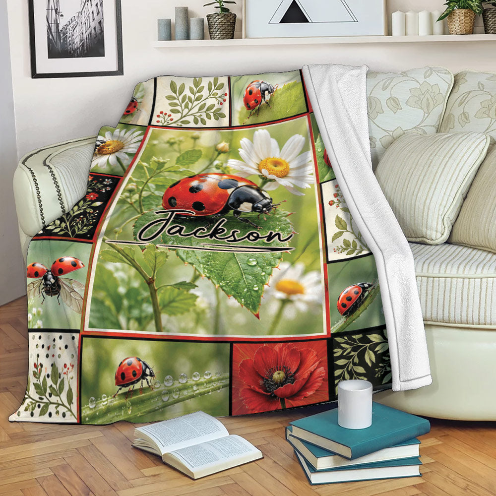 Ladybug throw blanket draped over a sofa with floral garden artwork and a cozy living room setting
