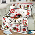 Floral ladybug throw blanket arranged on a couch, featuring detailed red and black ladybug artwork