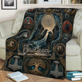 Norse-inspired Viking blanket displayed on a sofa with ravens, a world tree, knotwork, and mythic emblems
