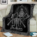 Black Viking blanket draped over a couch with a horned helmet, crossed axes, beard, and Nordic knotwork artwork