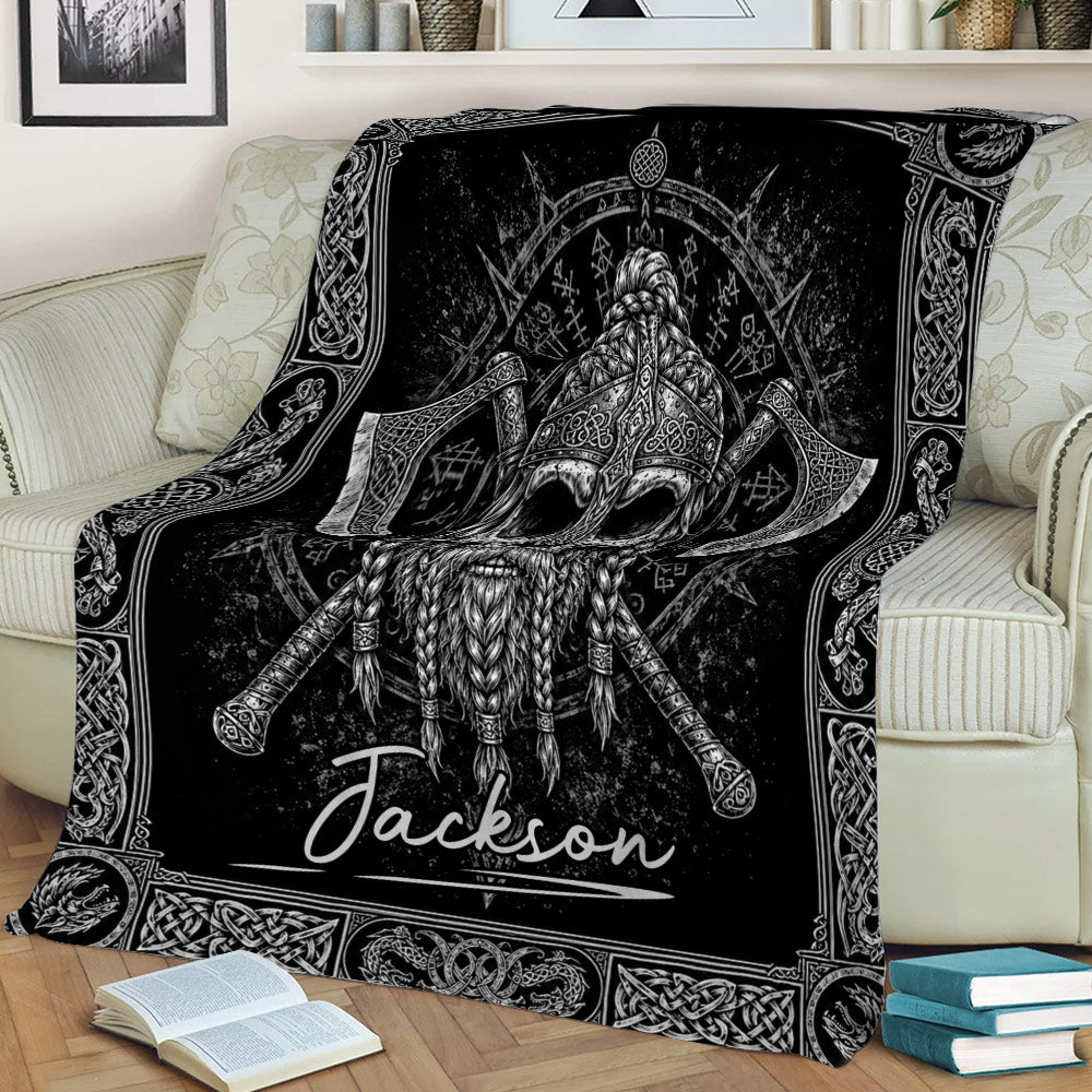 Black Viking blanket draped over a couch with a horned helmet, crossed axes, beard, and Nordic knotwork artwork