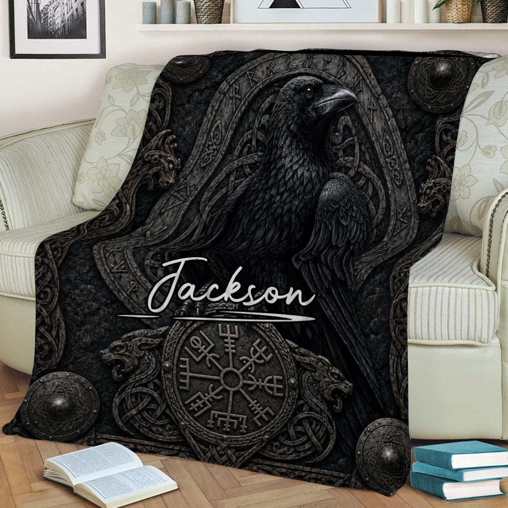 Close view of a Viking raven throw blanket with dark runic-inspired artwork on a sofa