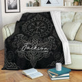 Viking throw blanket draped over a sofa with Nordic runes and ornate knotwork design