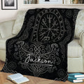 Black Viking throw blanket displayed on a sofa with Norse symbols and intricate gray knotwork
