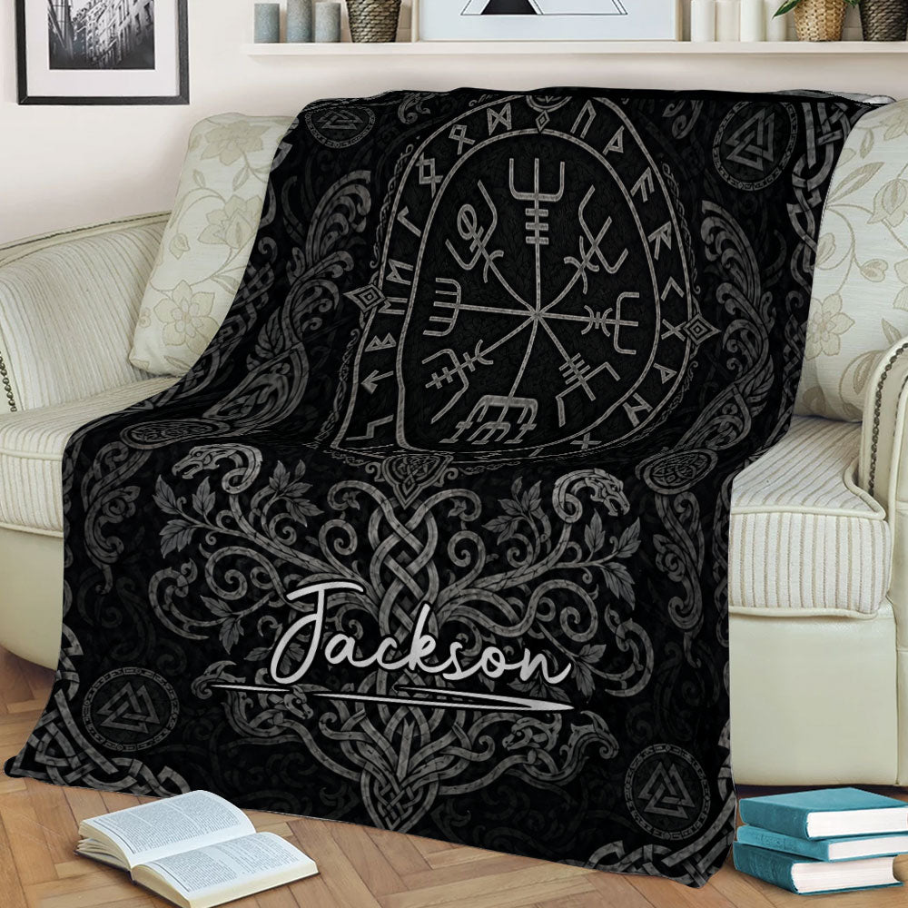 Black Viking throw blanket displayed on a sofa with Norse symbols and intricate gray knotwork