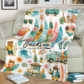 Tropical surfing throw blanket styled on a couch with surfboards, ocean waves, beach scenes, and floral details