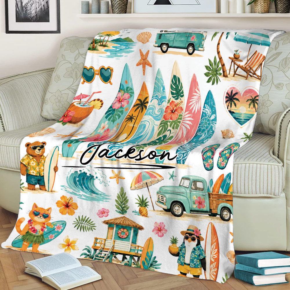 Tropical surfing throw blanket styled on a couch with surfboards, ocean waves, beach scenes, and floral details