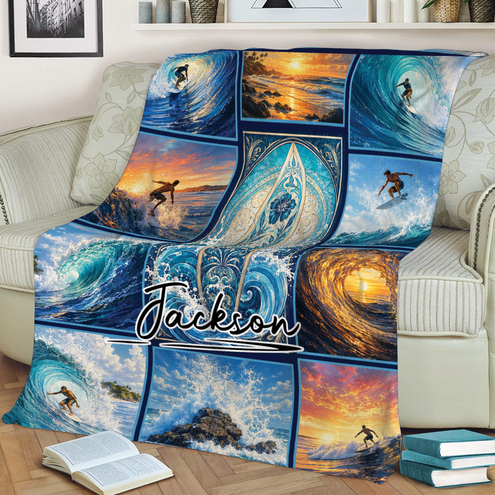 Surfing blanket displayed on a couch with surfers, ocean waves, sunset colors, and surfboard artwork