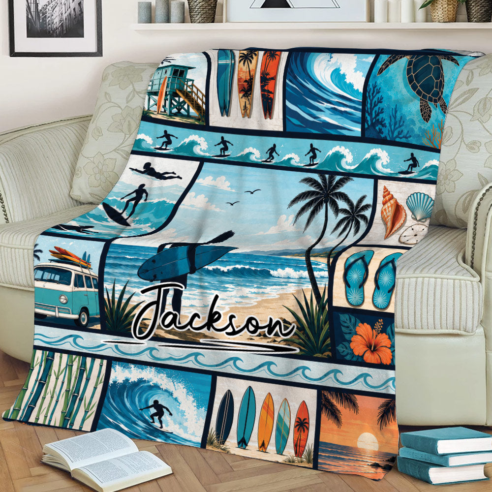 Surfing throw blanket displayed on a couch with surfers, tropical beach panels, waves, and coastal artwork