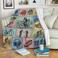 Bicycle throw blanket styled on a sofa with colorful vintage cycling panels and rider illustrations