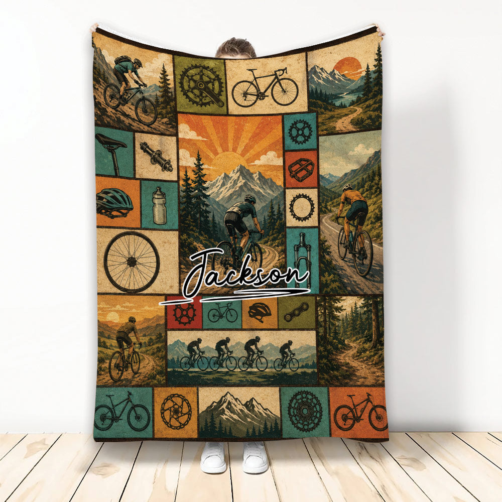 Vintage bicycle blanket featuring mountain cyclists, bike components, forest trails, and scenic mountain artwork