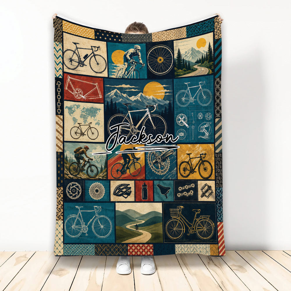 Bicycle blanket with vintage-inspired cycling collage, mountain scenes, bike parts, and rider artwork