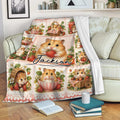 Strawberry hamster throw blanket displayed across a living room sofa