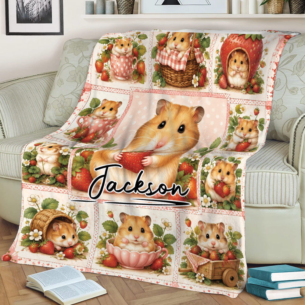 Close view of a whimsical hamster blanket with strawberries, flowers, and pink details