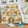 Hamster blanket draped over a sofa with sunflower artwork and multiple illustrated hamsters in decorative panels