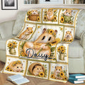 Close lifestyle view of a sunflower hamster throw blanket displayed across a couch with cozy reading decor