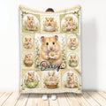 Hamster throw blanket featuring a daisy collage design with multiple cute hamsters in floral scenes