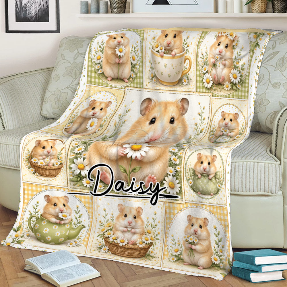 Cute hamster throw blanket displayed on a couch with daisy artwork and vintage-inspired panels