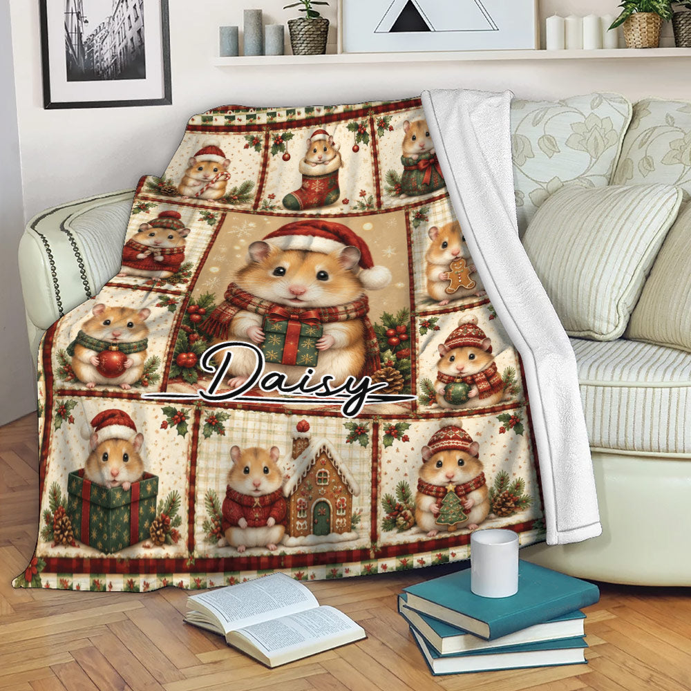 Christmas hamster throw blanket displayed on a couch with festive hamster scenes, gifts, and holiday decorations