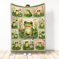 Frog throw blanket displayed upright with colorful frogs, lily pads, flowers, and vintage patchwork artwork