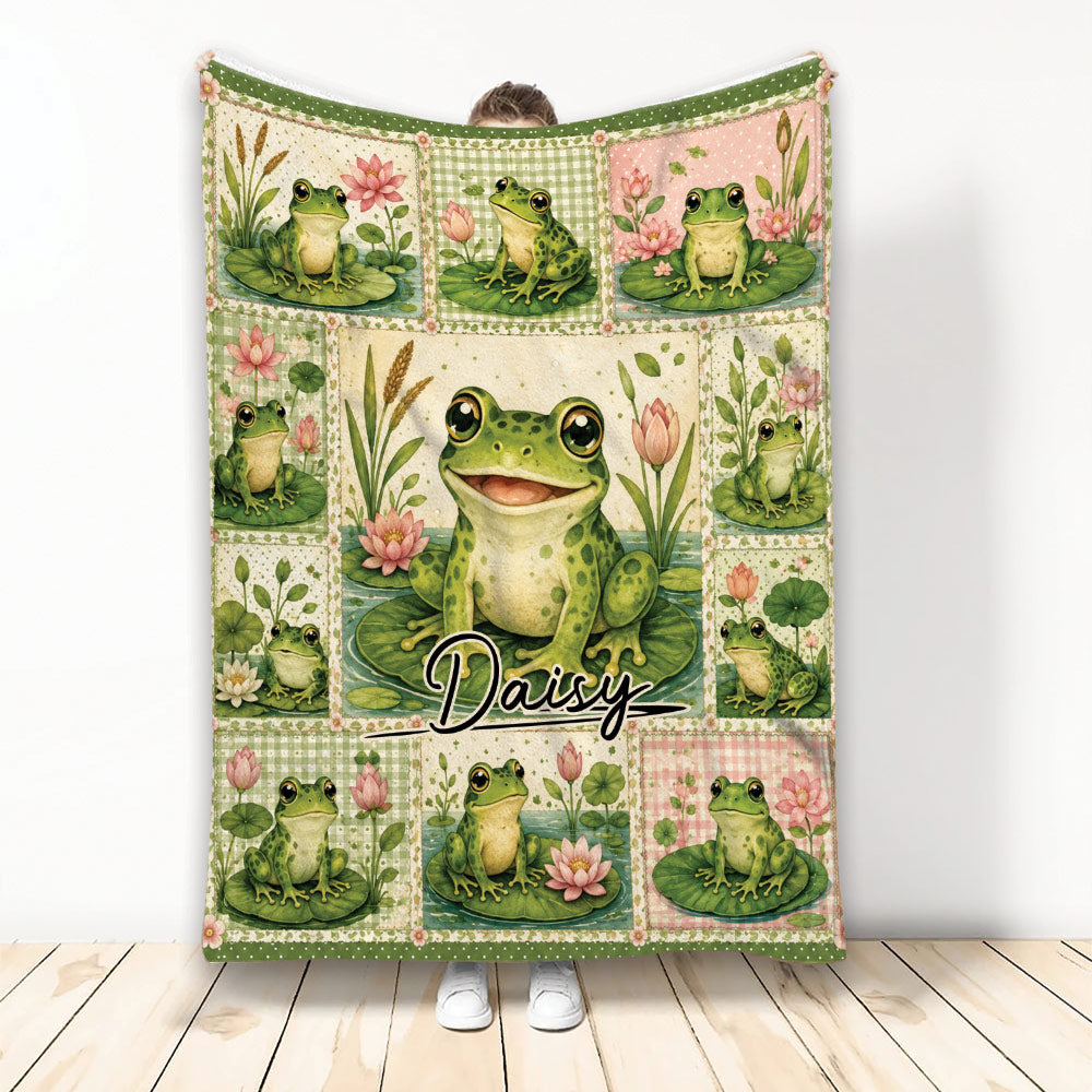 Frog throw blanket displayed upright with colorful frogs, lily pads, flowers, and vintage patchwork artwork