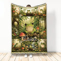 Custom frog blanket featuring green frogs, wildflowers, mushrooms, and a lush woodland collage