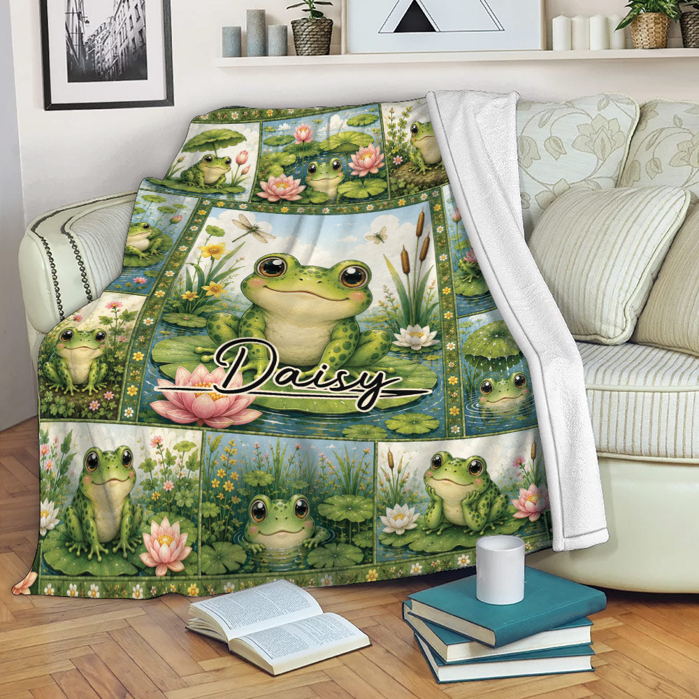 Frog blanket draped over a sofa with colorful pond artwork, lily pads, flowers, and multiple frogs