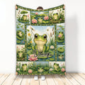 Frog throw blanket featuring a collage of green frogs, lily pads, lotus flowers, and pond scenery