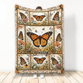 Custom butterfly blanket featuring orange butterflies and wildflowers in a botanical panel design