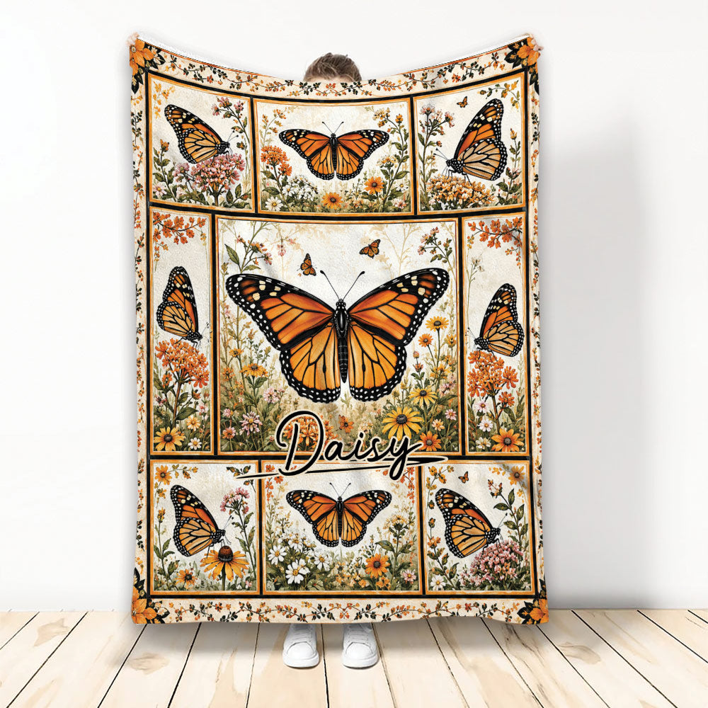 Custom butterfly blanket featuring orange butterflies and wildflowers in a botanical panel design