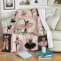 Ballet throw blanket draped over a sofa with pink ballerina, pointe shoe, and tutu collage design