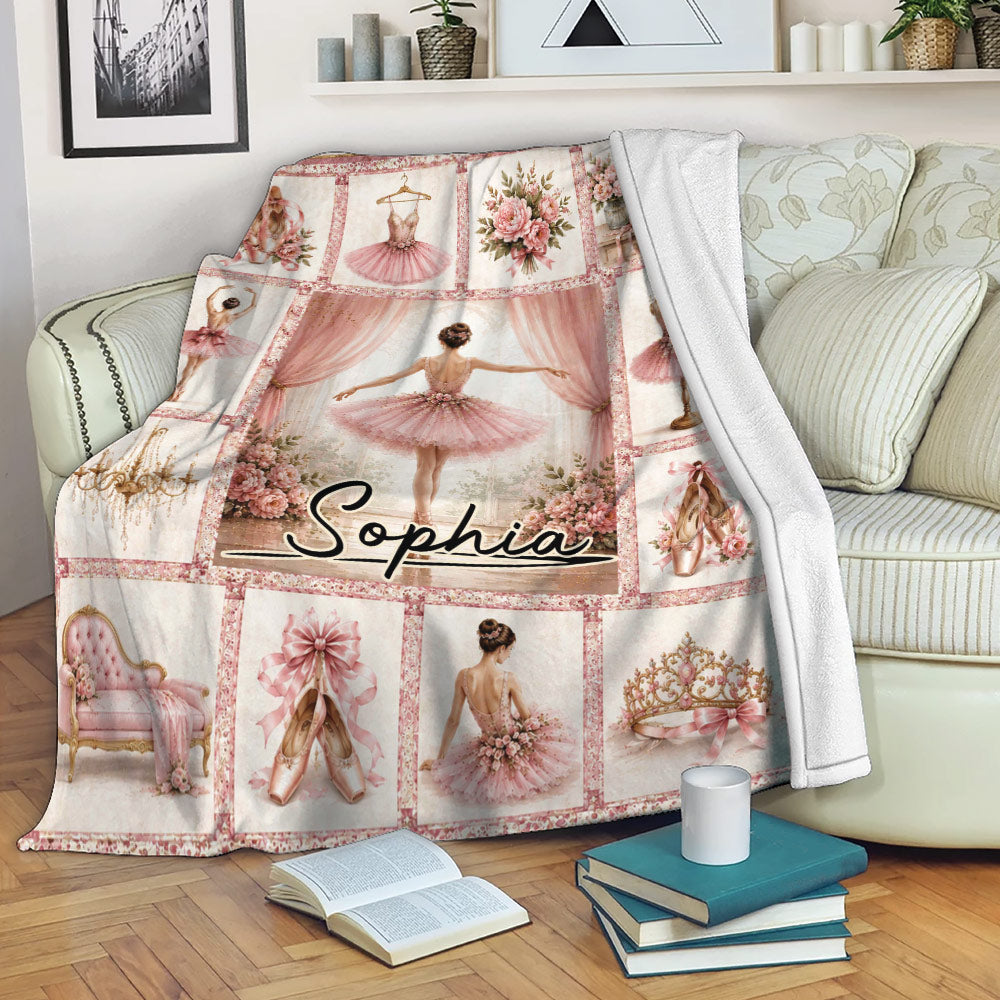 Pink ballet throw blanket draped over a sofa with ballerina, floral, and pointe shoe artwork