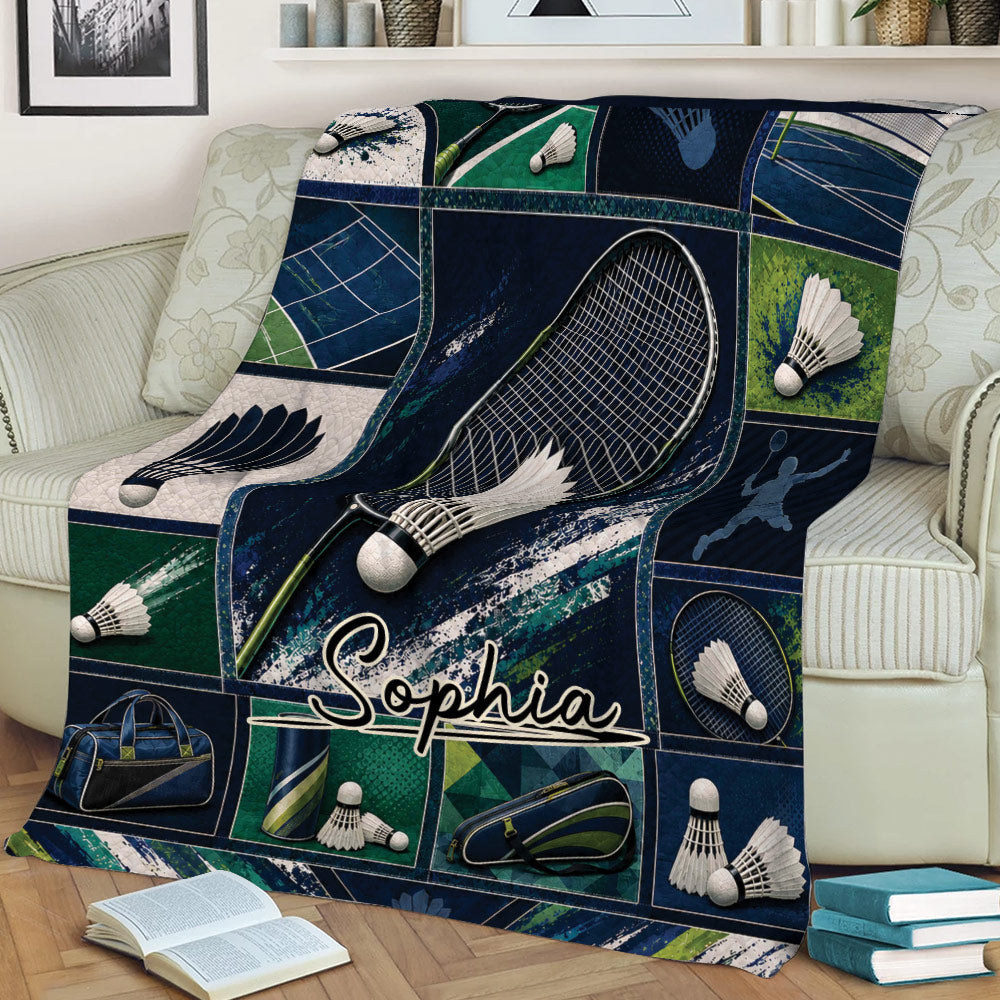 Badminton throw blanket draped across a sofa with detailed racket, shuttlecock, court, and sports bag artwork