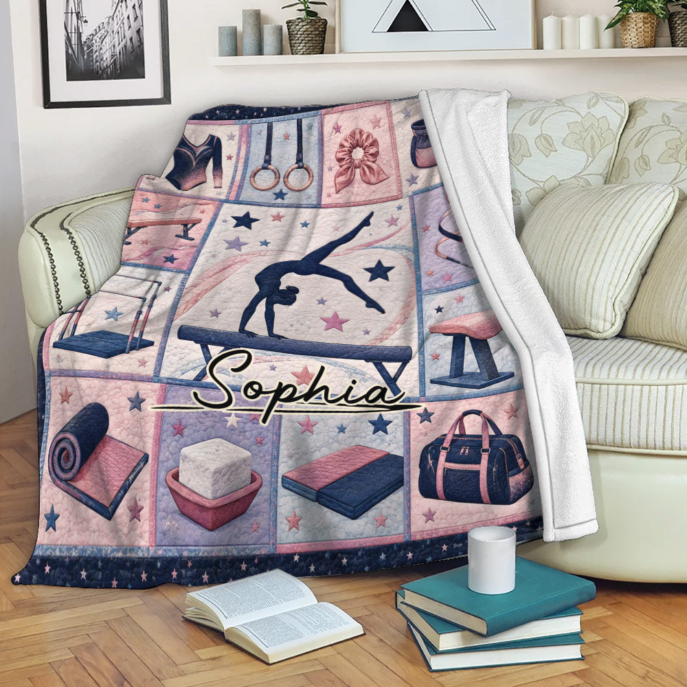 Custom gymnastics blanket draped over a sofa with gymnast artwork, gym equipment, stars, and pink navy colors