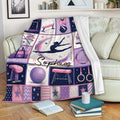 Gymnastics throw blanket displayed on a sofa with colorful gymnast and equipment artwork