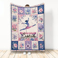 Gymnastics throw blanket with a leaping gymnast silhouette and colorful floral border