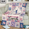 Gymnastics throw blanket draped over a sofa with colorful flowers and gymnast artwork