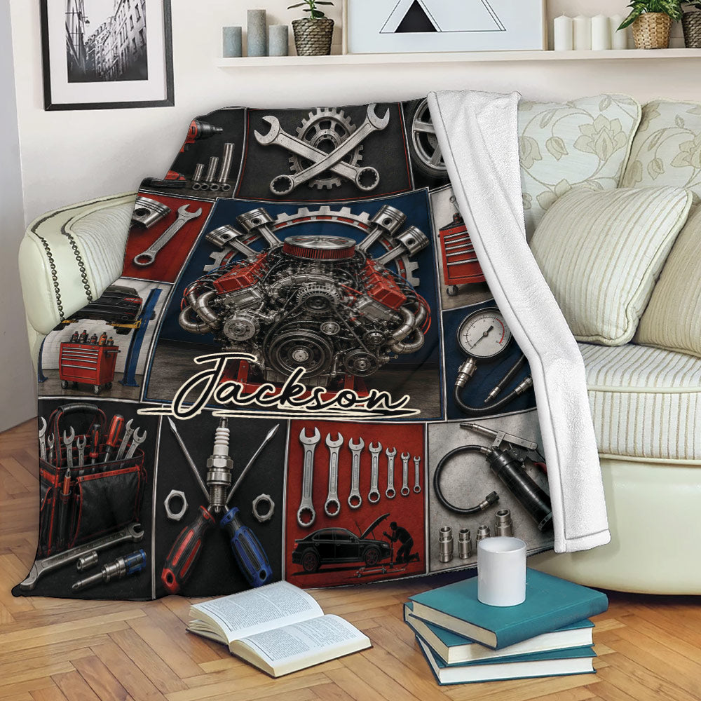 Mechanic throw blanket displayed on a sofa with engine and automotive tool collage design