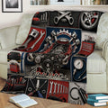 Automotive repair blanket draped over a sofa, featuring engine artwork, wrenches, pistons, and tools