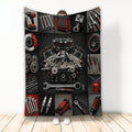 Mechanic throw blanket featuring an automotive engine, hand tools, gears, wheels, and red and black garage artwork