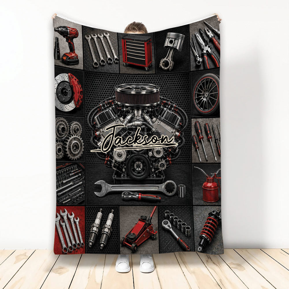 Mechanic throw blanket featuring an automotive engine, hand tools, gears, wheels, and red and black garage artwork
