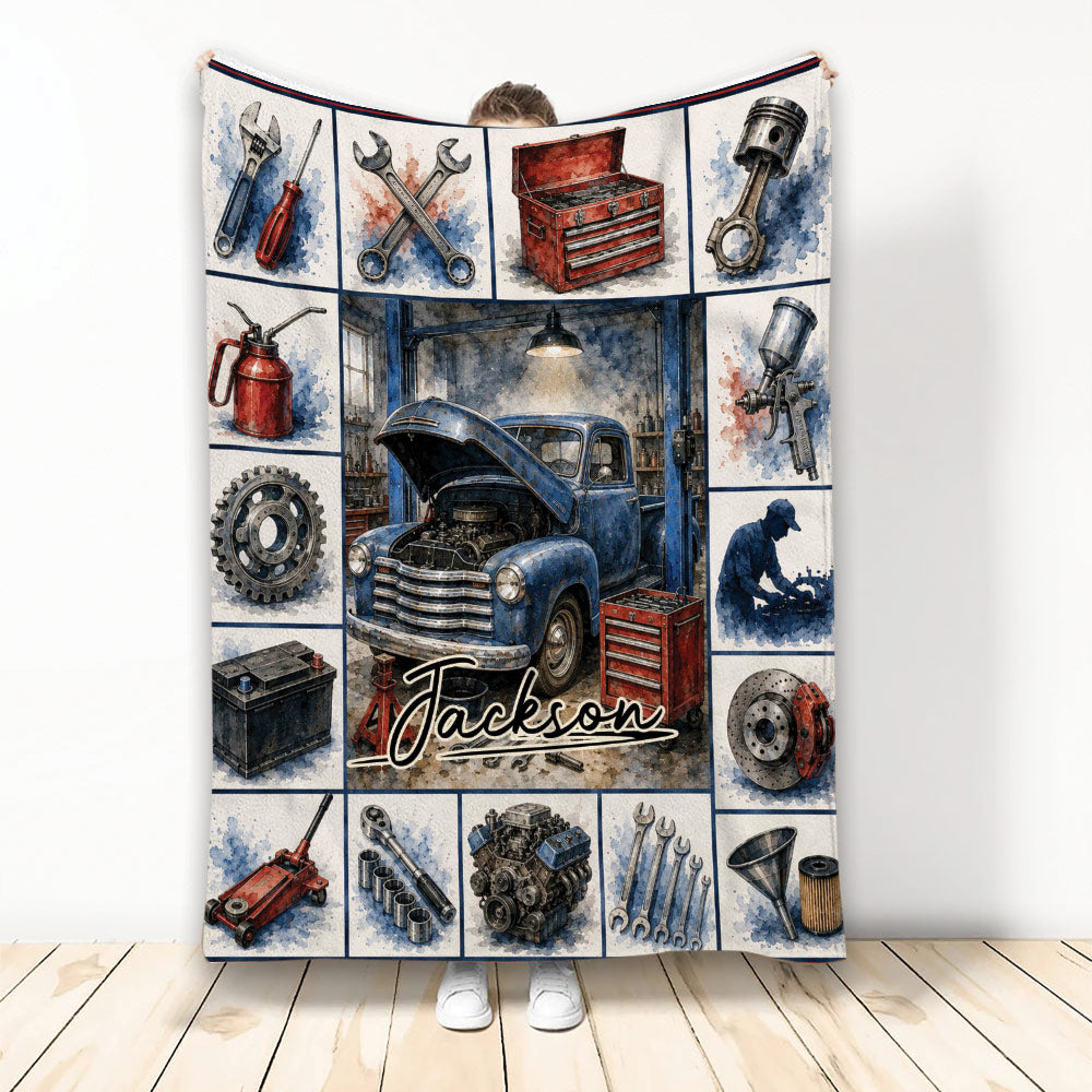 Mechanic throw blanket displayed with classic truck, automotive tools, engine parts, and garage artwork