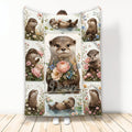 Otter throw blanket with floral panels, pond scenes, and wildlife artwork displayed upright