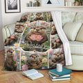 Otter blanket draped over a sofa with aquatic wildlife artwork and colorful water lily details