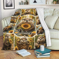 Otter throw blanket with sunflower artwork draped over a living room sofa
