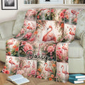 Flamingo blanket draped over a sofa, featuring a central flamingo surrounded by vibrant flowers